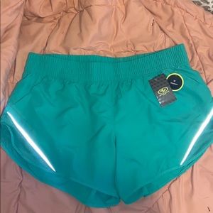 Green running shorts